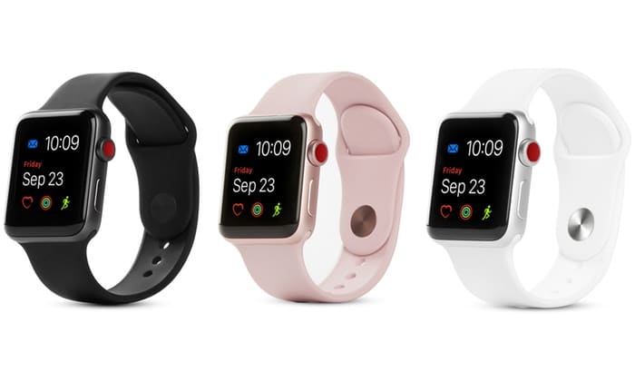 Three Apple Watch Series 3 smartwatches are displayed in a row, showing the same time (10:09) and date (Friday, Sep 23). From left to right, they feature black, pink, and white wristbands. Each watch screen shows icons for messages, weather, and fitness apps to track skiing or snowboarding activities.