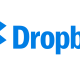 The image features the Dropbox logo, which consists of a blue open box icon made of four diamond shapes, next to the word "Dropbox" written in blue text. The overall design is minimalist and uses shades of blue, reflecting its seamless integration with iPad drag and drop support.