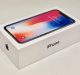 A white iPhone box with the word "iPhone" and the Apple logo on the side, containing an iPhone X with a display showing 9:41 AM and a colorful wallpaper. The box is set against a plain light background, showcasing one of the best displays of the year.