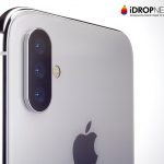 Close-up of the back of a silver iPhone featuring a triple lens camera setup on the top left. The Apple logo is visible in the center. The image is branded with "iDROPNEWS" designed by Martin Hajek, hinting at what to expect from the iPhone launch next year. The background is white.