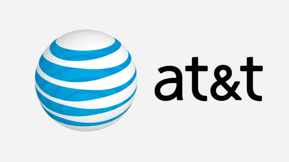 A logo featuring a blue and white striped globe on the left, representing a stylized sphere with layered curved lines symbolizing AT&T's reach in mobile 5G cities, next to lowercase black letters "at&t" on the right, all set against a light gray background.