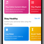 A smartphone screen displays different app suggestions, enhanced by Siri Shortcuts in iOS 12. Categories include music with "Explore Apple Music," health with options like "Log Water" and "Brush Teeth," and reminders with "Put It On The Calendar." Each category features vibrant, colorful cards.