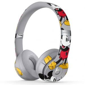 Celebrate Mickey Mouse's 90th anniversary with a pair of wireless headphones that feature a predominantly grey color and an all-over print showcasing various poses of Mickey in red, white, yellow, and black. These sleek, modern headphones also come with cushioned ear pads for added comfort.