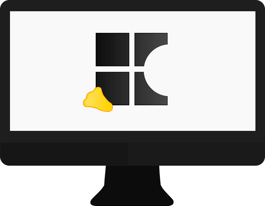 A black computer monitor displaying a simplified depiction of the Windows logo, which has one pane appearing incomplete as if partially eaten, and a small piece of cheese positioned near the bottom left of the logo—a subtle Micro Dig at Apple.