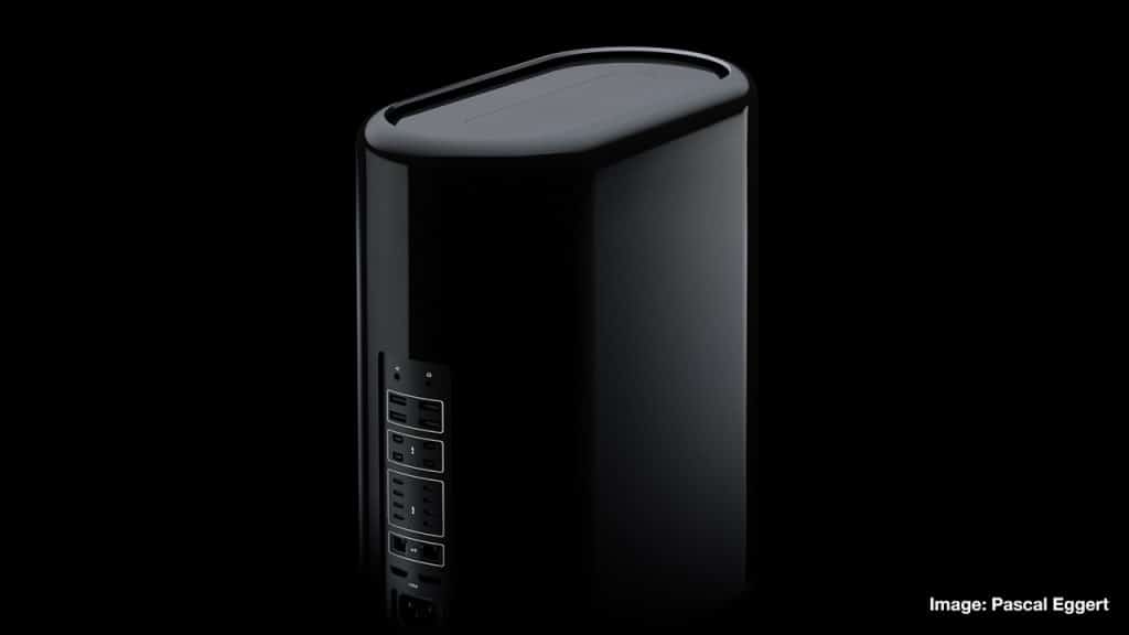 A sleek, black, cylindrical Mac Pro tower with multiple ports and connectors on one side. The background is black, making the device stand out prominently. The image is credited to Pascal Eggert. Stay tuned for its imminent release.