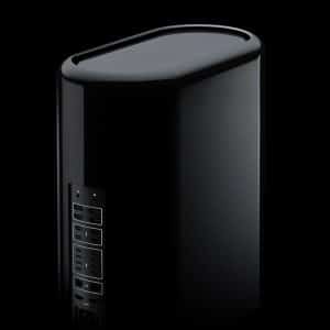 A sleek, black, cylindrical Mac Pro tower with multiple ports and connectors on one side. The background is black, making the device stand out prominently. The image is credited to Pascal Eggert. Stay tuned for its imminent release.