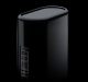 A sleek, black, cylindrical Mac Pro tower with multiple ports and connectors on one side. The background is black, making the device stand out prominently. The image is credited to Pascal Eggert. Stay tuned for its imminent release.