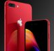 A close-up image of a discounted red 2018 iPhone model with a reflective back and a dual camera setup. The phone's screen is partially visible, showing a colorful abstract wallpaper. The Apple logo is prominently displayed on the back, while the background features a gradient of dark shades.