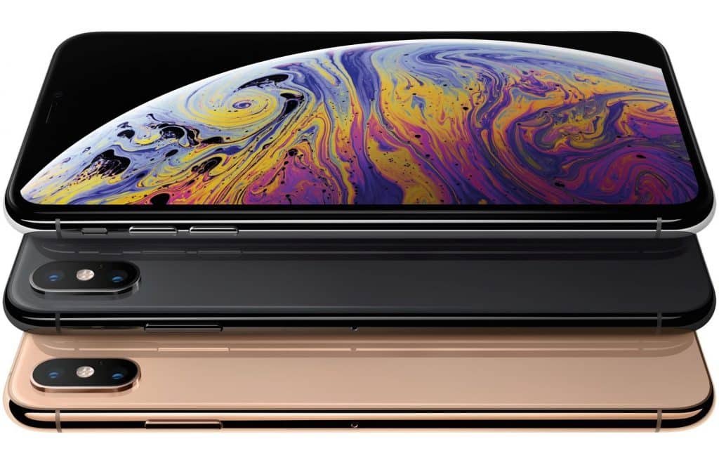 Three sleek, modern smartphones are shown in black, gray, and gold colors, stacked horizontally. The top iPhone's screen displays a vibrant, colorful design resembling a close-up of a planetary surface. The back of each 2019 model features a dual-camera setup with advanced lenses.