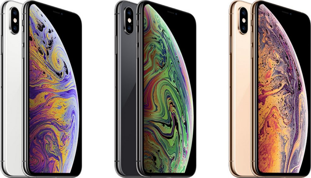 Three iPhones are displayed vertically next to each other. From left to right, the phones are colored silver, space gray, and gold. Each phone features a screen with a vibrant, swirling abstract design. All phones are the same model.