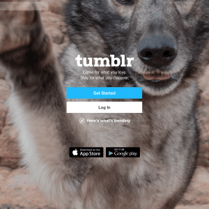 A Tumblr login page displaying a close-up image of a wolf with its paw raised. The login options include "Get Started" and "Log In." Links to download the Tumblr app from the App Store and Google Play are also visible at the bottom of the screen, showcasing Verizon's latest features post-sell off.