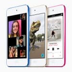 A set of three Apple iPod Touch devices in blue, white, and pink displayed side by side. Showcasing impressive performance, the screens feature a video call with multiple participants, an augmented reality game with a dinosaur, and a music player playing a song by SASAMI.