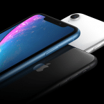 Three iPhones are displayed against a black background. The phones are in blue, black, and white. The blue phone is featured prominently with its screen on, displaying a colorful abstract wallpaper. The black and white phones show their backs and side profiles, reminiscent of the sleek design of the iPhone XR 2.