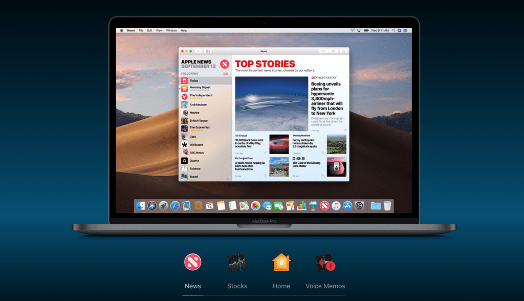 A MacBook Pro screen displays an app with a 'Top Stories' news section. The visible headline reads, “Daring reveals plans for supersonic passenger jet.” The desktop background shows a desert landscape, and the dock shows the Apple News, Stocks, Home, and Voice Memos apps.