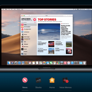 A MacBook Pro screen displays an app with a 'Top Stories' news section. The visible headline reads, “Daring reveals plans for supersonic passenger jet.” The desktop background shows a desert landscape, and the dock shows the Apple News, Stocks, Home, and Voice Memos apps.