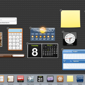 A screenshot of a macOS Catalina dashboard featuring multiple widgets including a sticky note, calendar, dictionary, calculator, clock, weather, translation tool, search bar, stock chart, and a photo collage of cats. The background is dark grey with a textured pattern. Apple just makes it seamless.