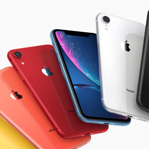 A fanned-out display of six new iPhones in different colors—yellow, coral, red, blue, white, and black—all showcasing the Apple logo on the back. The 2020 iPhones are angled to show both their backs and sides against a pristine white background.