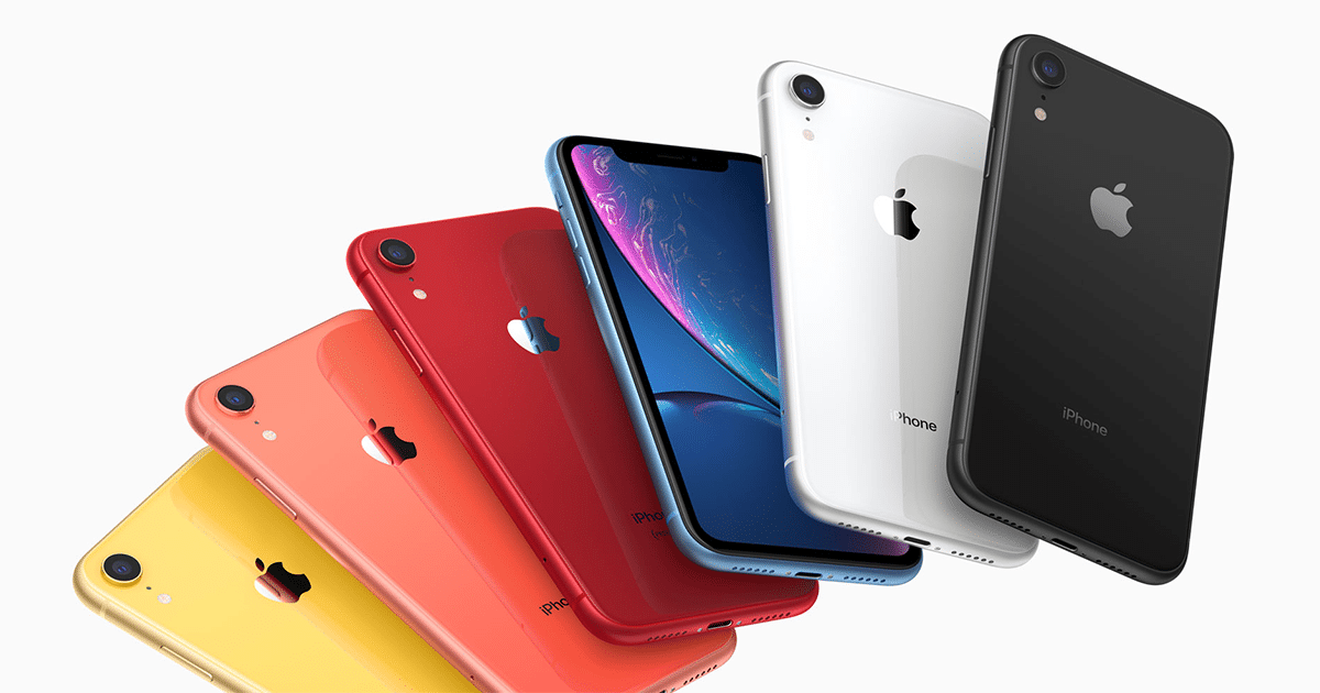 A fanned-out display of six new iPhones in different colors—yellow, coral, red, blue, white, and black—all showcasing the Apple logo on the back. The 2020 iPhones are angled to show both their backs and sides against a pristine white background.