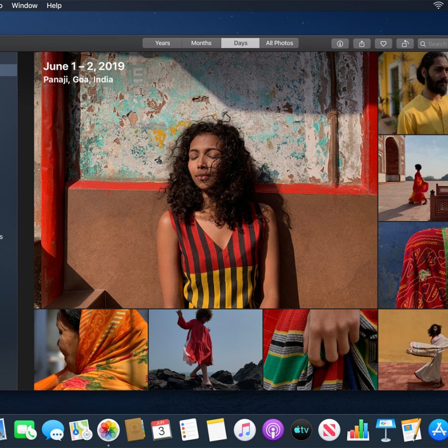 A computer screen displaying a photo management application. The main photo shows a woman with curly hair, wearing a striped dress, standing against a colorful wall. Smaller thumbnails of various scenes and people are visible below. Date: June 1-2, 2019. Location: Panaji, Goa, India.