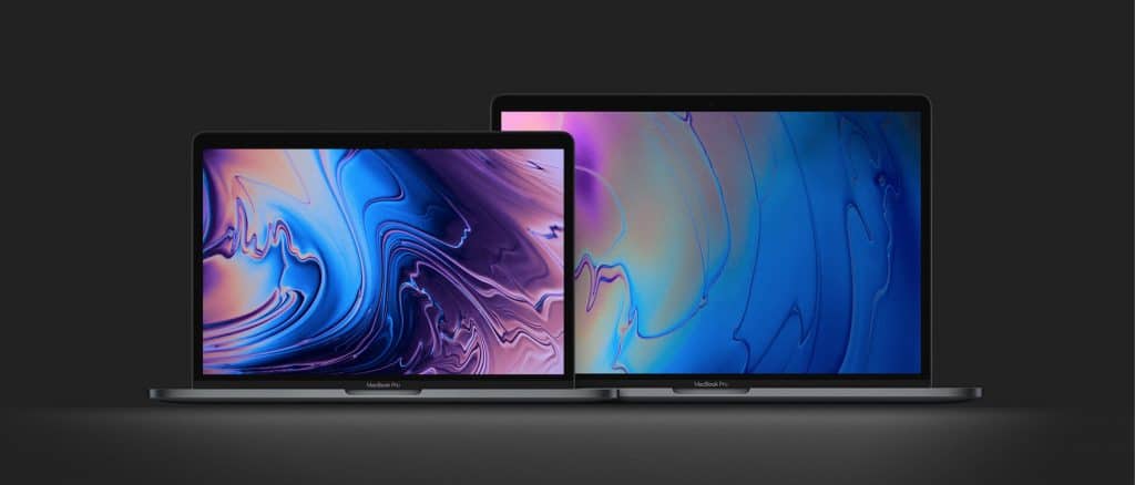 Two MacBook laptops are displayed on a dark background. The laptop on the left is smaller, with a colorful abstract wallpaper featuring purples and blues. The larger laptop on the right has a similar abstract wallpaper with predominantly blue shades. Both devices are open, exemplifying best practices in Mac cyber safety.