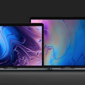 Two MacBook laptops are displayed on a dark background. The laptop on the left is smaller, with a colorful abstract wallpaper featuring purples and blues. The larger laptop on the right has a similar abstract wallpaper with predominantly blue shades. Both devices are open, exemplifying best practices in Mac cyber safety.