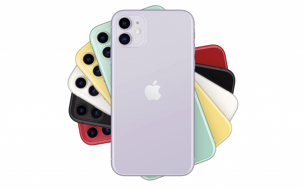 A collection of 2019 iPhones, arranged in a fan shape, showcasing various colors including purple, yellow, green, black, white, and red. The frontmost Apple phone is purple, displaying its back with the iconic logo and dual camera setup.