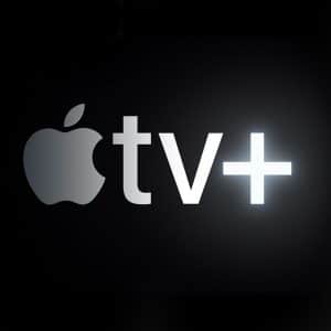 A black and white image shows the Apple TV+ logo in the center with the apple icon followed by "tv+" in a sleek, luminous font. On the right side is a smiling woman's face partially visible against a dark background. "AppleMagazine.com" and "November 1 launch date" are in the bottom right corner.