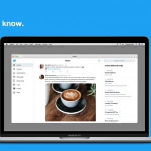 A laptop running macOS displays a Twitter homepage against a blue background. The screen shows tweets, one featuring a photo of latte art coffee. On the left is a navigation menu, and on the right, trending topics. "Stay in the know." is written in white on the upper left, reflecting Project Catalyst's seamless integration.