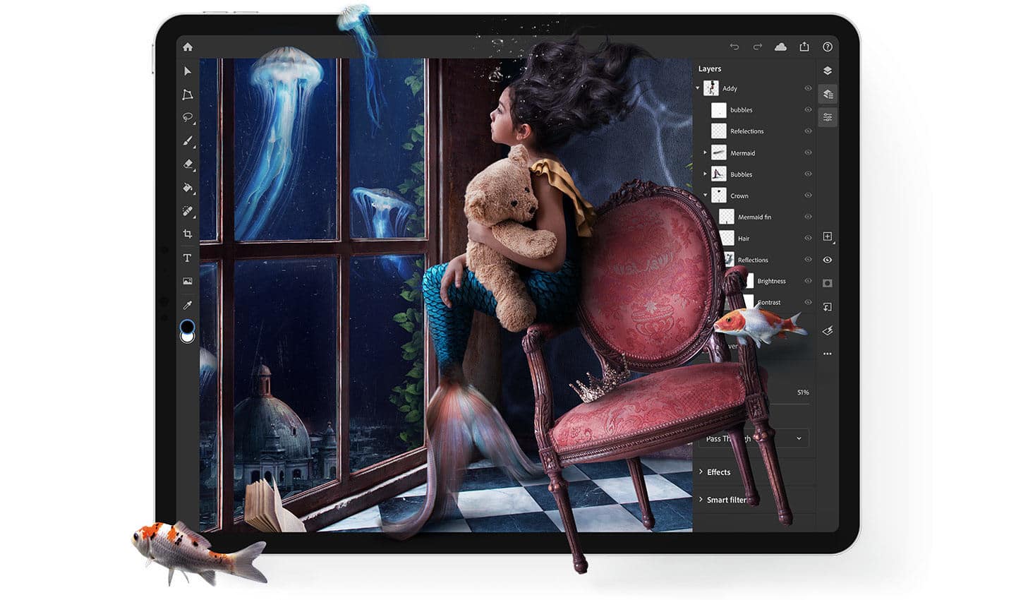 An iPad screen displays a digital artwork being edited in Adobe Photoshop. The artwork shows a girl clutching a teddy bear, sitting on a red chair by a window with an underwater scene featuring floating jellyfish and swimming fish. The editing interface surrounds the artwork.