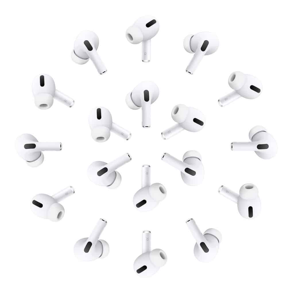 A collection of Apple AirPods Pro arranged in a circular pattern against a plain white background. Each earbud has a smooth, glossy surface with black accents for the speaker and microphone openings, reflecting the brand's sleek design as they focus on doubling production.