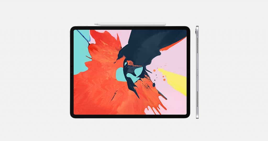 An iPad Pro with a colorful abstract wallpaper is displayed on a white background. The tablet has slim bezels and a stylus magnetically attached to the top edge. The side view shows its thin profile, buttons, and volume rocker, making it a sleek investment in modern computing technology.