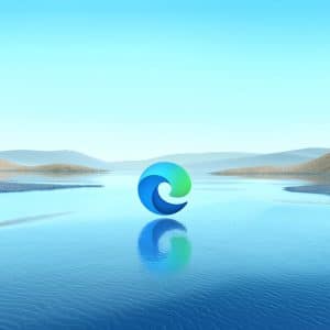 A serene body of water stretches towards distant hills, all under a clear blue sky. In the center of the image is the updated browser Microsoft Edge logo, floating above the water's surface, casting a subtle reflection.