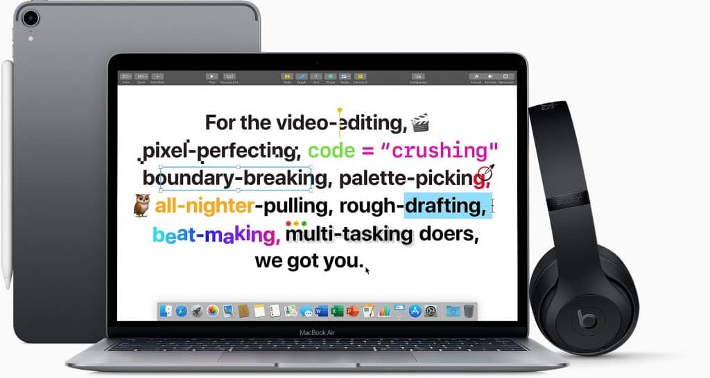 An open MacBook Air with colorful highlighted text on the screen. A pair of black Beats headphones rests on the right, and a closed iPad is behind the MacBook. The text mentions various creative and tech activities, referencing video editing, coding, and multitasking—perfect for Apple's Back to Uni promotion.