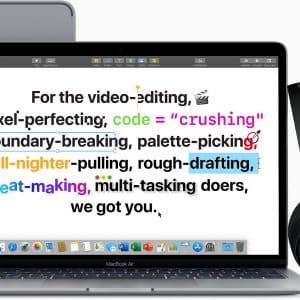 An open MacBook Air with colorful highlighted text on the screen. A pair of black Beats headphones rests on the right, and a closed iPad is behind the MacBook. The text mentions various creative and tech activities, referencing video editing, coding, and multitasking—perfect for Apple's Back to Uni promotion.