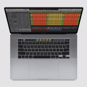 A MacBook Pro with an open Logic Pro music production software on the screen, showing a multi-track project with different colored audio waveforms. Powered by ARM-based processors, the laptop's keyboard and trackpad are visible, and the screen is vivid, set against a light gray background.