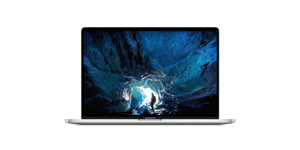 A silver MacBook Pro with a black keyboard and a glowing screen showing an image of a person standing in a blue ice cave. The person is silhouetted against the light from the cave entrance. This ARM Mac by Apple features the text on the lower bezel, highlighting its impressive launch.