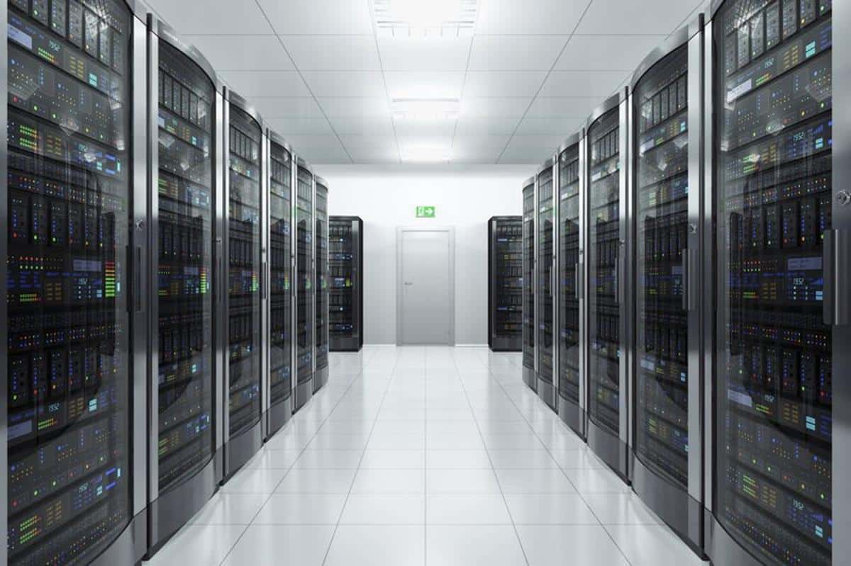 A long, brightly lit hallway in a data center houses rows of server racks on both sides, with interconnected cables and blinking LED lights. The clean, white-tiled floor mirrors the meticulous preparation needed for passing the CEH exam, symbolizing a gateway to EC-Council CEH certification success.