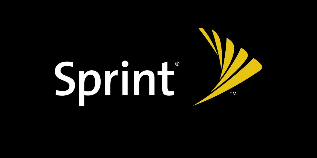 Bold white letters spell "Sprint®" against a black background, accompanied by a yellow, wing-shaped logo to the right of the text. The yellow logo consists of three intersecting curved lines. A small "TM" symbol appears at the bottom right of the logo as Sprint begins to phase out in favor of T-Mobile.