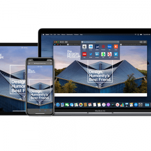 A display of three Apple devices: an iPad with Apple Pencil support, an iPhone, and a MacBook. All screens show the same image of a building with the text "The Design Museum" and "Design: Humanity's Best Friend." The image features a modern architectural design.