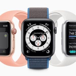 Three smartwatches are displayed side by side. The smartwatch on the left has a pink band and a workout goal screen. The central smartwatch, equipped with Apple watchOS 7, has a blue fabric band with an analog-style tachymeter display. The smartwatch on the right has a white band and a sleep-tracking screen.