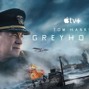 Promotional poster for the new movie "Greyhound" on Apple TV+, featuring Tom Hanks in a military uniform. The background shows a stormy sea battle with explosions and naval ships, emphasizing a World War II setting. The title "Greyhound" is prominently displayed.