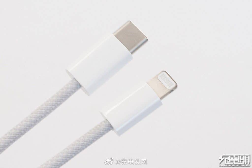 Close-up of a braided lightning cable with USB-C and Lightning connectors on a light background. The cable, designed for added durability, is ideal for Apple devices like the iPhone 12.