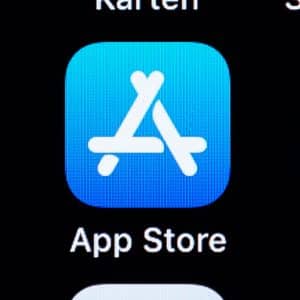 Close-up of the App Store icon on a smartphone screen. The icon features a stylized white "A" on a blue background with "App Store" written below. Adjacent icons for other apps are partially visible, reflecting the surge in app purchases during the COVID-19 pandemic.