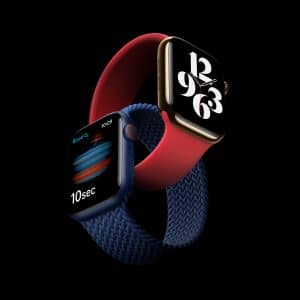 Two smartwatches against a black background. One, an Apple Watch Series 6, has a red band with a large, modern clock face. The other, an Apple Watch SE, has a blue band with a health monitoring screen showing blood oxygen measurement and a 10-second timer. Both are showcased in a dynamic, intertwined position.