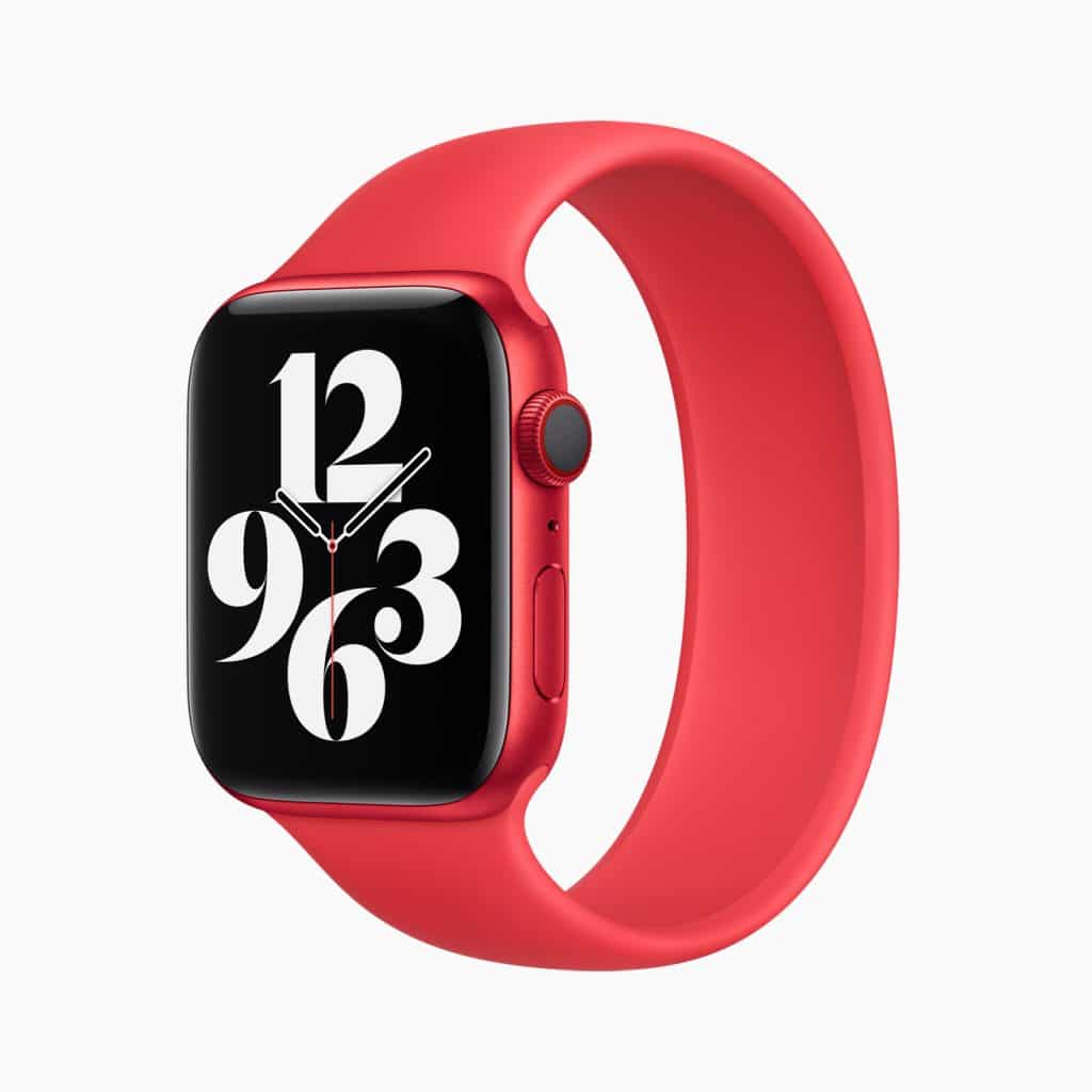 A red smartwatch with a red band is shown against a plain background. The smartwatch display shows the time with large, white numerals and stylized clock hands.