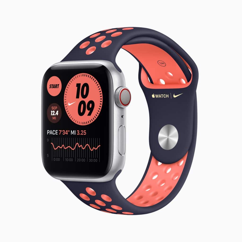 A smartwatch with a black and orange perforated band displays a fitness interface on its screen, including time, pace, distance, and a graph. The watch also has Nike and Apple branding on the strap and sides of the screen.