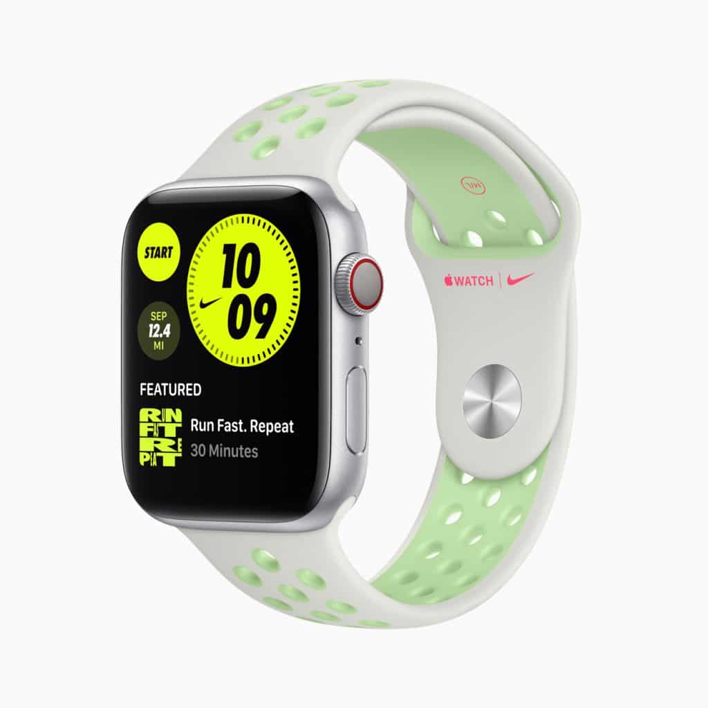 An Apple Watch with a white and light green Nike sport band. The watch display shows the time as 10:09 and features a fitness app screen with a "Run Fast. Repeat" workout option. The Nike logo is visible on the watch band.