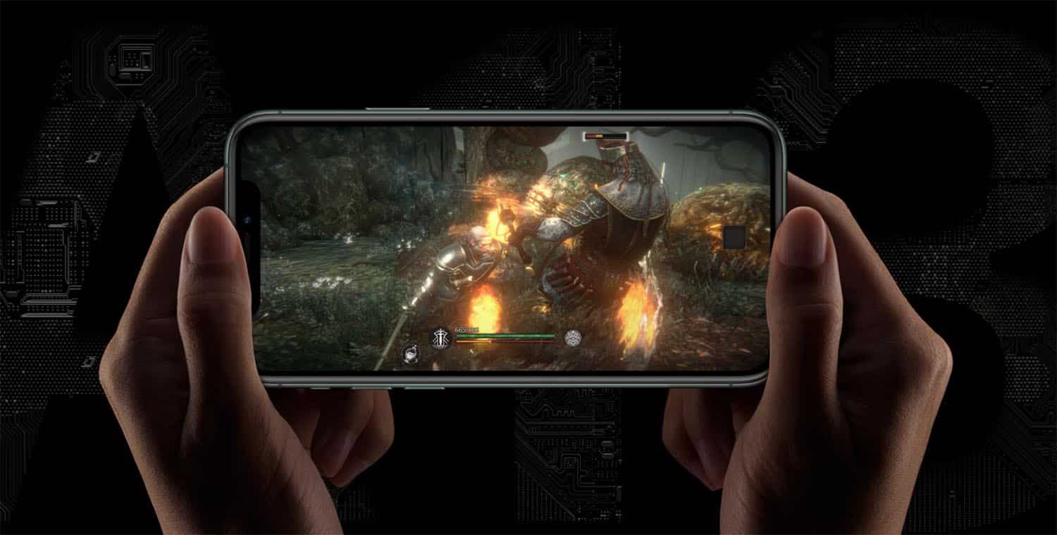 Hands holding a smartphone horizontally display an action scene from a mobile game. The screen shows a knight fighting a large monster with fire effects. The background is dark with abstract circuitry patterns, capturing the essence of modern mobile gaming on an Apple device.