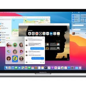 An open MacBook Pro displays the macOS Big Sur interface with multiple applications running, including Safari, Mail, Messages, Contacts, and App Store. The background is a colorful gradient, and the Dock is visible at the bottom of the screen—just one of many reasons to get excited as it launches tomorrow.