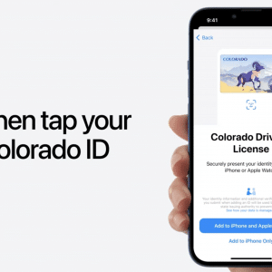 A hand holds an iPhone displaying a Colorado Driver's License on the screen. The text on the left reads, "Then tap your Colorado ID." The phone screen also shows a button for adding the ID to Wallet app, making it convenient for iPhone users and Apple Watch integration.